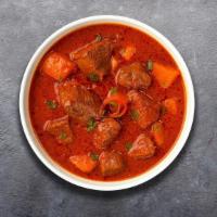 Lamb Vindaloo In Vain · Juice lamb cooked in a spicy pungent curry with potatoes.