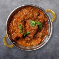 Feisty Fish Goan Curry · Fish cooked in a tomato based onion gravy with ground spices.