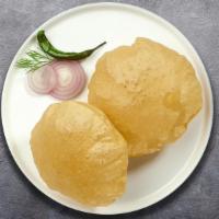 Rich & Poori · Deep fried Indian bread cooked until golden crisp. Two pieces.