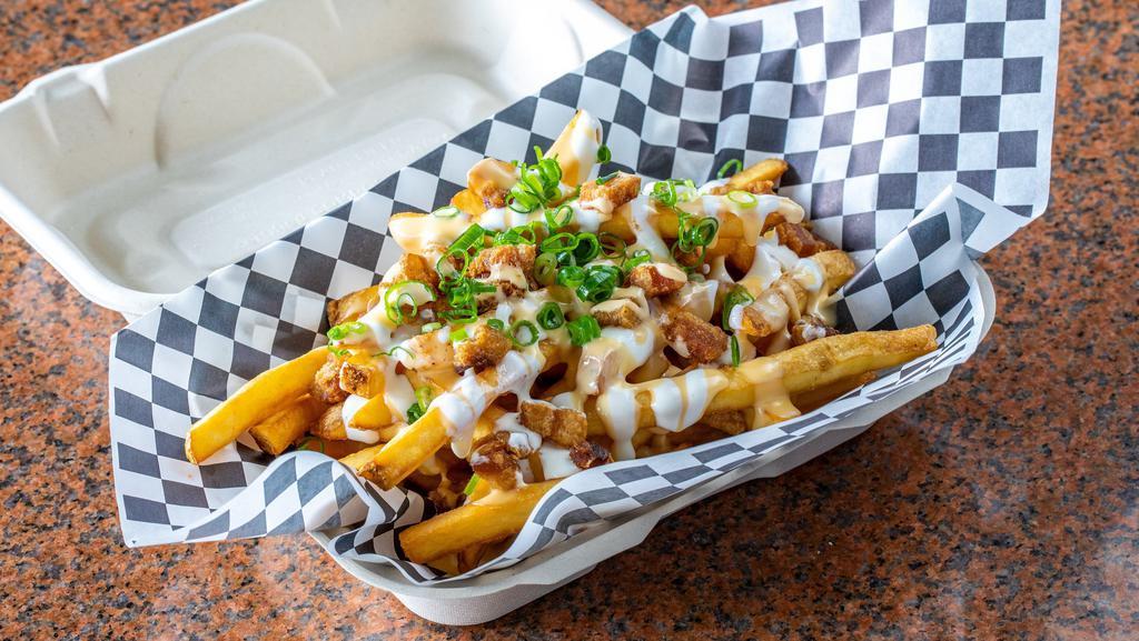 Loaded Fries · Sour Cream, Green Onions, House Cheese Sauce & Bacon.