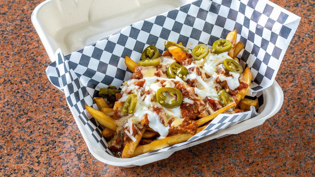 Spicy Brisket Chili Fries · Loaded with Sour Cream, Cheese, Onions & Jalapeño.
