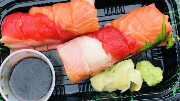 Sashimi Lover Roll · Spicy tuna crunch, salmon, yellowtail and mango avocado inside, no rice, soy paper topped with fresh tuna, salmon and yellowtail wasabi yuzu sauce.