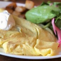 California Omelet · Farm fresh eggs, mushrooms, scallions, tomatoes, cheddar, topped with avocado and side of so...