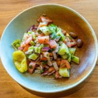 Shepherd Salad · Diced fresh cucumbers, onions, tomatoes, green peppers, and parsley topped with Feta cheese,...