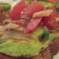 Vegan Bruschetta · Garlic-grilled bread with avocado, basil, and tomatoes.