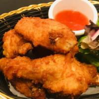 Bangkok Wings · Crispy chicken wings marinated with Thai seasoning served with sweet chili sauce.