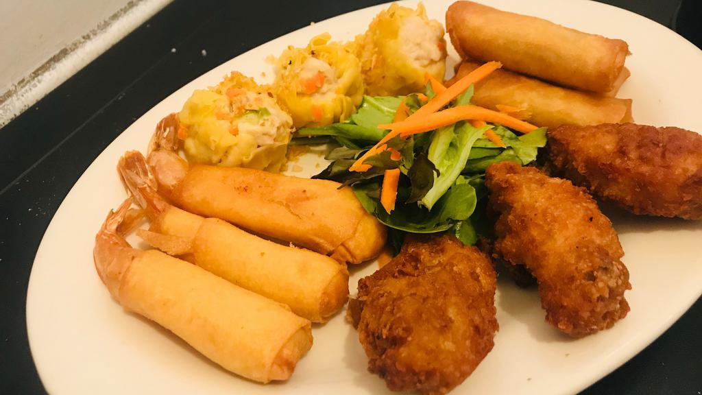 Deluxe Appetizer Assortment · Two spring rolls, three Chicken Wings, three Thai dumplings, and two crispy shrimp rolls.