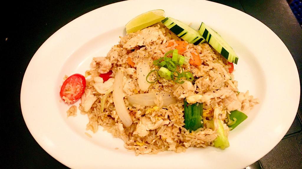 Siamese Fried Rice · Traditional Thai fried rice with onion, tomato, carrot, green pea, and egg.