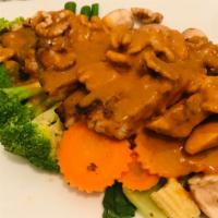 Chicken Walnut · Grilled marinated chicken breast served with steamed mixed vegetables topped with walnut sau...