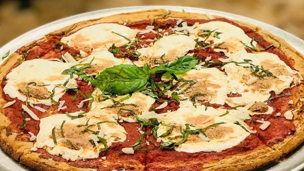 Margherita Pizza · Tomato sauce and Homemade mozzarella cheese & Basil