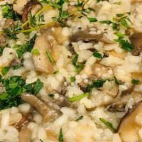 Wild Mushroom Risotto · Authentic Italian-style risotto cooked the slow way, but so worth it. Lopped with parmesan.