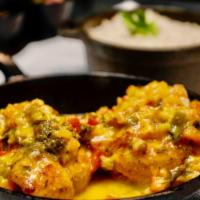 Brazilian Fish Stew - Moqueca · Traditional Brazilian Fish Stew with fish of the day, shrimp, yucca, and seasonal vegetables...