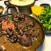 Feijoada Plate · Brazilian speciality dish of black beans with an assortment of meats with your choice of 2 s...