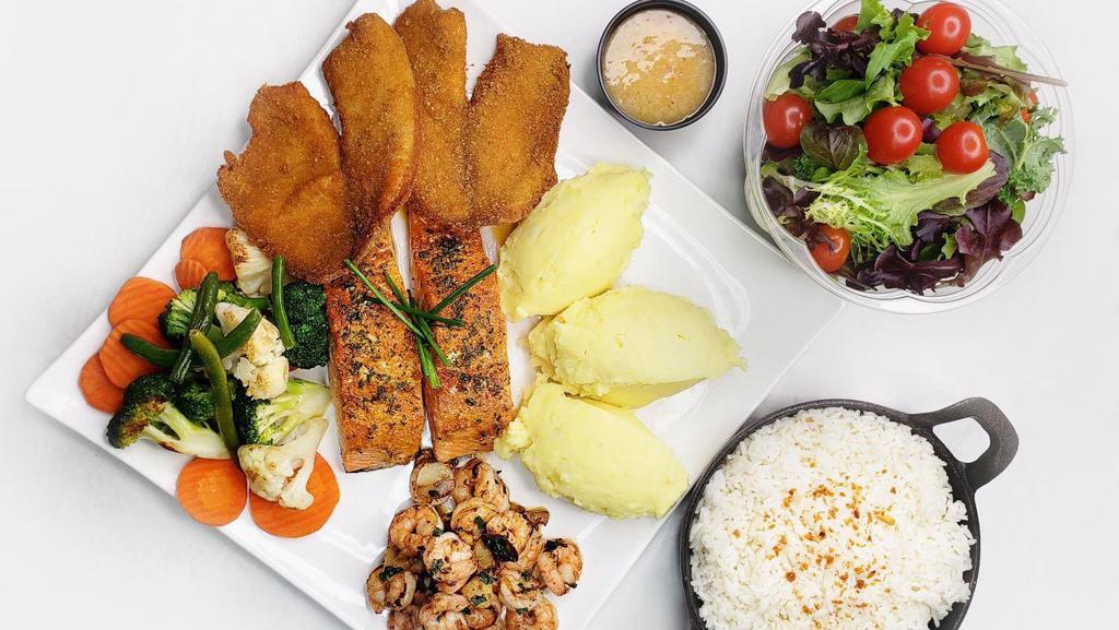 Seafood Family Style · 2 filets of salmon, 4 filets of tilapia, and a portion of shrimp. Includes 4 sides of your choice and a small salad.