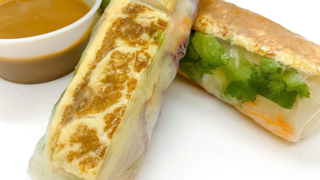 Scallion Omelette Summer Rolls · 2 rolls with egg omelette, lettuce, purple cabbage, cucumber, rice noodles, pickled daikon-carrot, and cilantro. - Served with peanut sauce***
Please notify a staff if you have dietary restrictions or allergies.