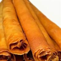 Crunchy Monster Spring Rolls · 2 rolls of 8 inch fried spring roll filled with ground pork and vegetables, wrapper made of ...