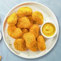Nugget Begets Nugget · Bite sized nuggets of chicken breaded and fried until golden brown. Served with your choice ...