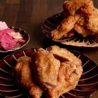 Pado Chicken Wings · Fried chicken wings. Choice of 2 flavors: soy garlic & misugaru