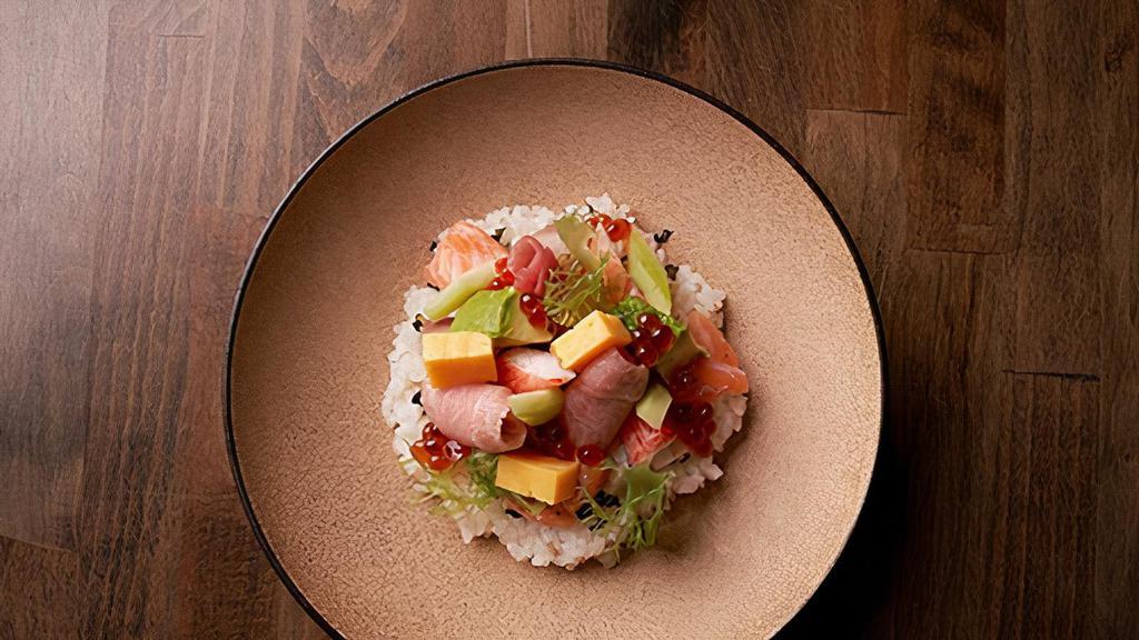 Sashimi Don · 10 pieces assorted sashimi (2pcs tuna, 2pcs hamachi, 2pcs salmon, 2pcs unagi, 2 pcs scallop & tamago) over sushi rice.