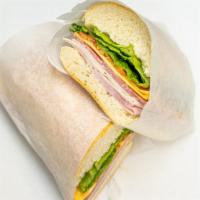 Italian Sandwich · Most popular. Ham, salami, turkey, cheese, lettuce, onion and Italian dressing.