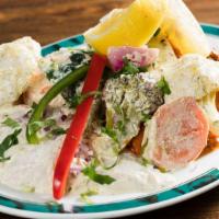 Indika Mix Platter · Marinated lamb, chicken and seafood with sautéed veggies.