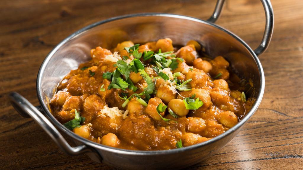 Chana Masala · Chickpeas cooked in a traditional onion-tomato gravy.