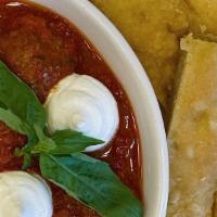 Meatballs  · Three homemade beef meatballs with whipped ricotta and focaccia bread.