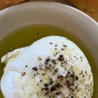 Burrata And Sicilian Olive Oil · Local Burrata with Sicilian Olive oil, flaky salt and a piece of our homemade bread