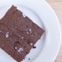 Super Fudgy Brownie · A neighborhood (and staff) fave! Slightly crispy on the outside, fudgy on the inside! What's...