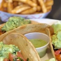 Shrimp  Tacos · 3 tacos made with shrimp topped with pico de gallo guacamole green salsa and cilantro.