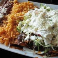 Chilaquiles Verdes Plate · Served with beans, onions, cheese and cream.