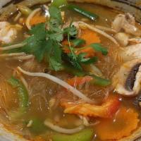 Tom Yum Chicken Soup · Hot and sour chicken broth with lime juice, bell peppers, mushroom, and cilantro.