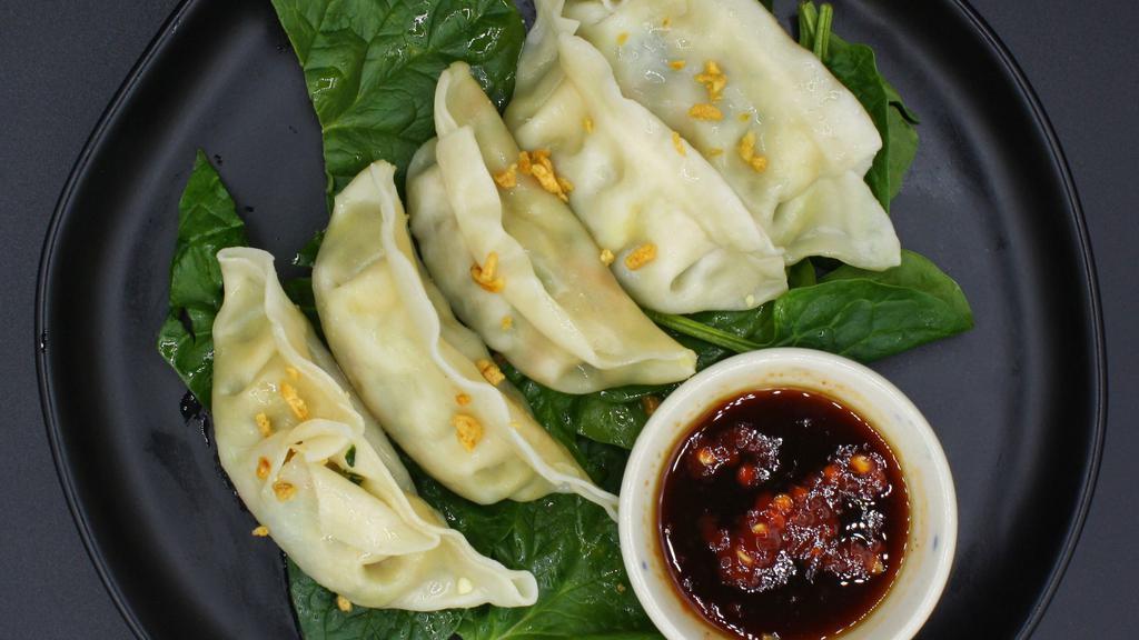 Veggie Dumpling (Vegetarian) · Most popular. Vegetarian. Steamed and stuffed vegetable dumpling served with sweet soy sauce.