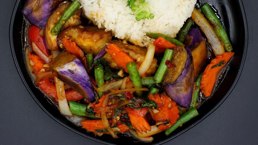 Spicy Eggplant Grapow · Sautéed long purple eggplant with chili, onions, carrots, string beans, and fresh basil. Spicy.