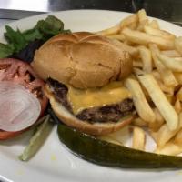 Cheeseburger Deluxe · Cheeseburger topped with lettuce, tomato and onion.  Served with French fries and a pickle.