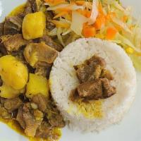 Curry Goat · Served with choice of rice and peas, white rice, steam vegetables, or raw salad.