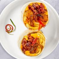 Be The Bacon Breakfast Burrito · Bacon, eggs, cheddar cheese, tomatoes and onions wrapped in a flour tortilla.