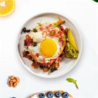 El Huevo Ranchero Eggs · Lightly fried eggs served on a warm tortilla and topped with salsa, tomatoes, chili peppers,...