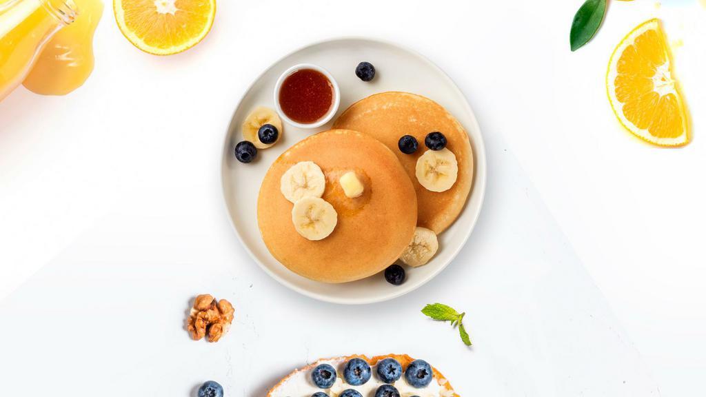 Berry Merry Pancake · Fluffy banana and berries pancakes cooked with care and love served with butter and maple syrup. Served in pairs.