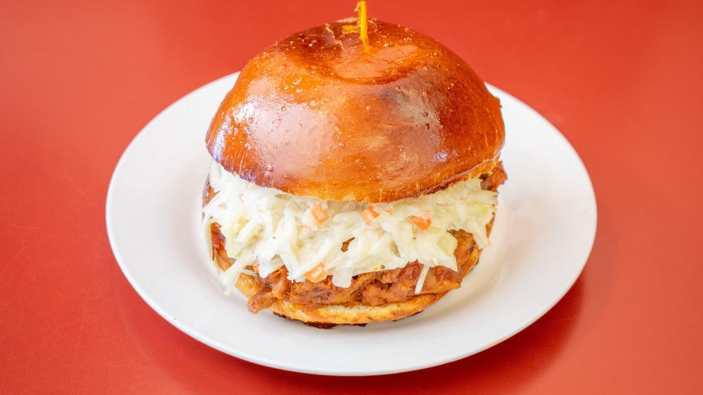 Pulled Pork Sandwich · Pulled pork, Swiss cheese, and coleslaw. Includes kettle chips.