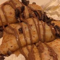 Nutella Crepes · French crepes with sautéed bananas, sliced strawberries, Nutella, crushed oreo cookies, and ...
