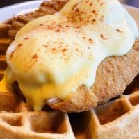 Fried Chicken & Waffles Benedict · our waffle topped with fried chicken tenders, two poached eggs & Hollandaise sauce