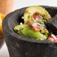 Guacamole · Vegan. Gluten-free. Freshly muddle avocados, red onions, tomatoes, cilantro lime juice and y...