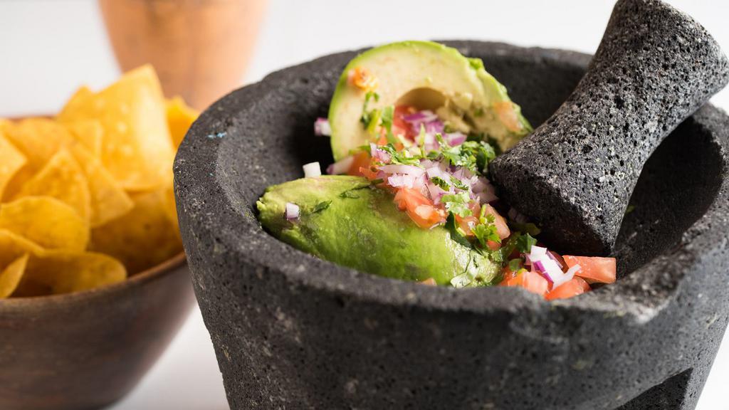 Guacamole · Vegan. Gluten-free. Freshly muddle avocados, red onions, tomatoes, cilantro lime juice and yellow corn chips