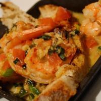Espana-Gambas Al Ajillo · Shrimp cooked in garlic and white wine served with bread points.