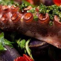 Grilled Pulpo · Grilled Octopus Served with Crispy Chorizo, Purple Potatoes and Roasted Peppers topped Parsl...