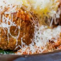 Eggplant Meatballs · Vegetarian. Homemade eggplant meatballs in Spanish tomato 
sauce topped with queso fresco an...