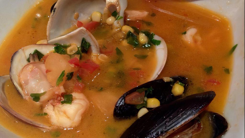 Chupe · South American chowder with clams, shrimp, mussel, yucca.
