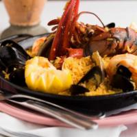 Espana-Palomino Paella · Gluten free. Seafood paella with shrimp, clams, mussels, chorizo, chino latino lobster rice ...