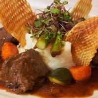 Braised Beef Short Ribs · Short Ribs braised with herbs and Rioja Wine served with mashed potatoes and Au jus